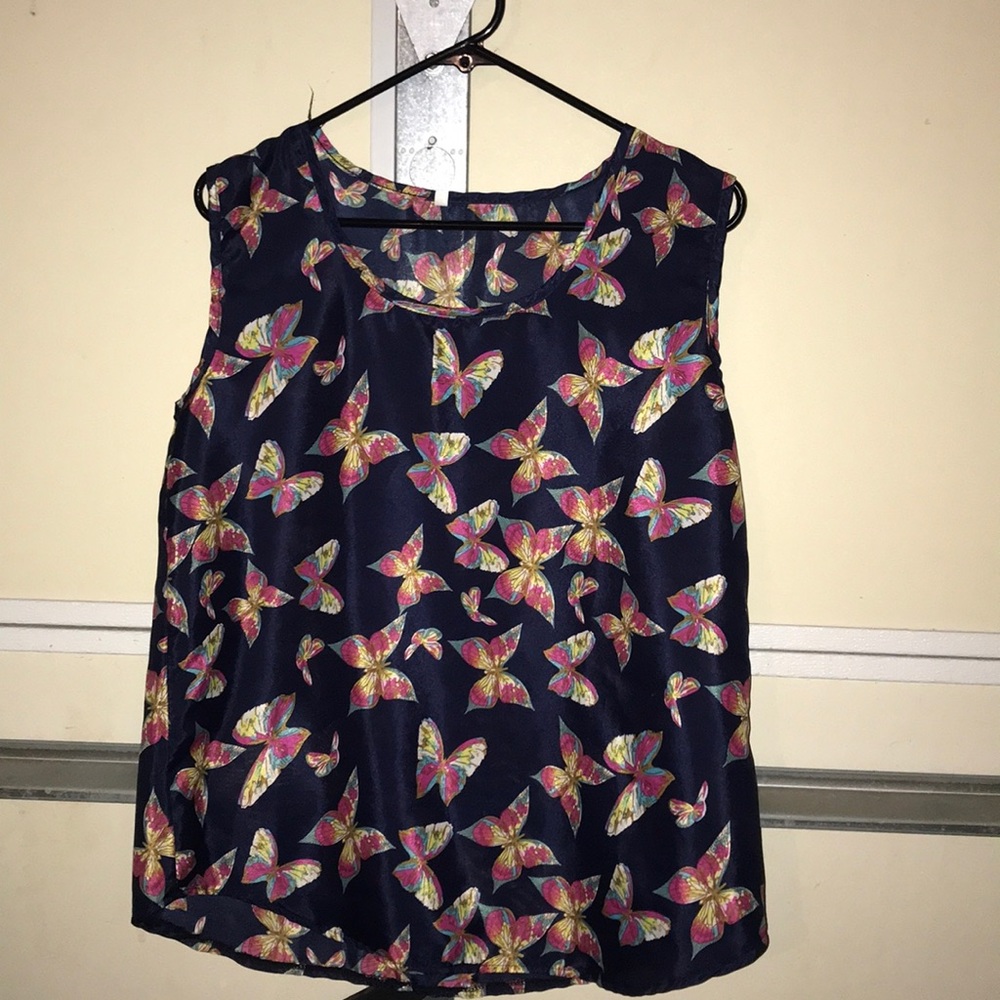 A sheer butterfly tank top